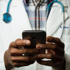 Doctor using smart phone
